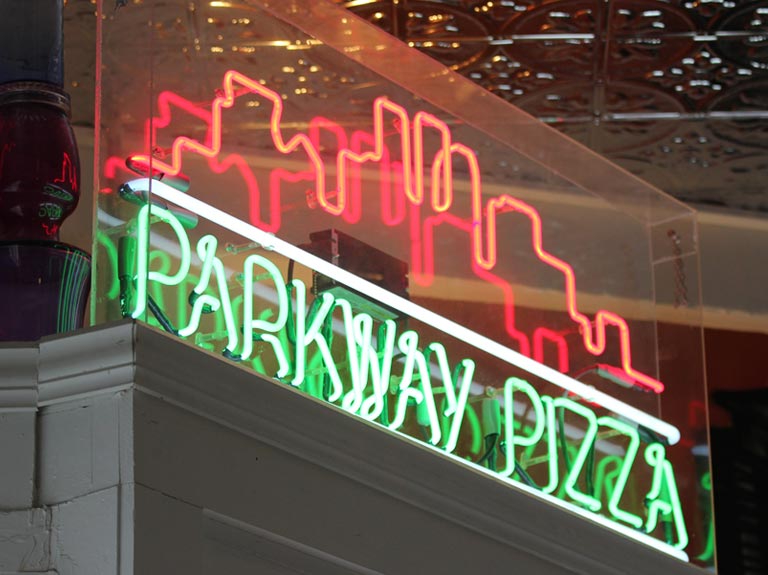 Photograph of Parkway Pizza neon sign.