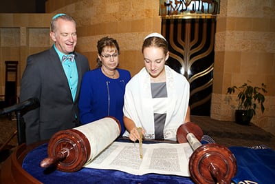Person at synagogue with family.