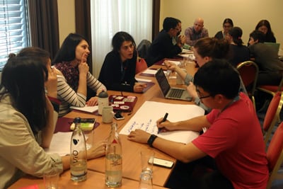 A diverse team of individuals actively engaged in a planning session.
