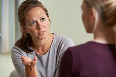 A person meeting with a psychiatrist.