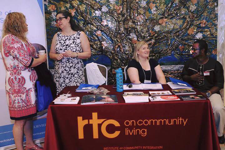 Photo of 3 staff from ICI and one participant attending the African Mental Health Summit.